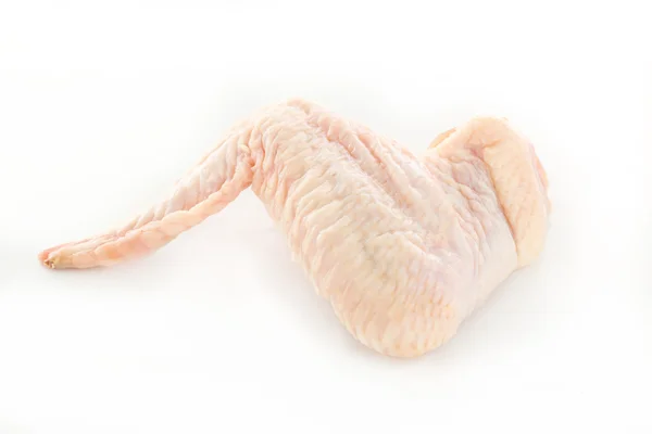 Alitas de pollo crudas sobre un fondo blanco —  Fotos de Stock