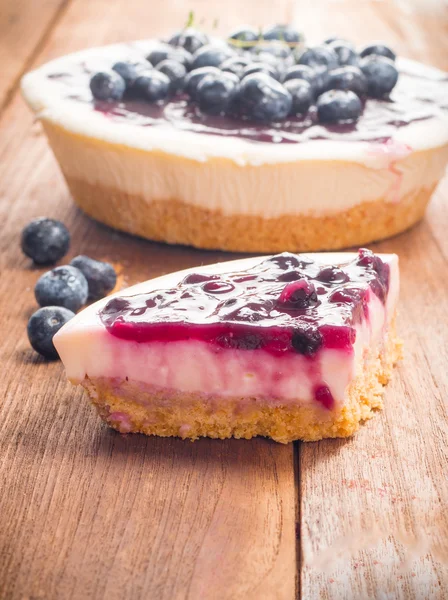 Blueberry cheese pie cake on wood table — Stock Photo, Image