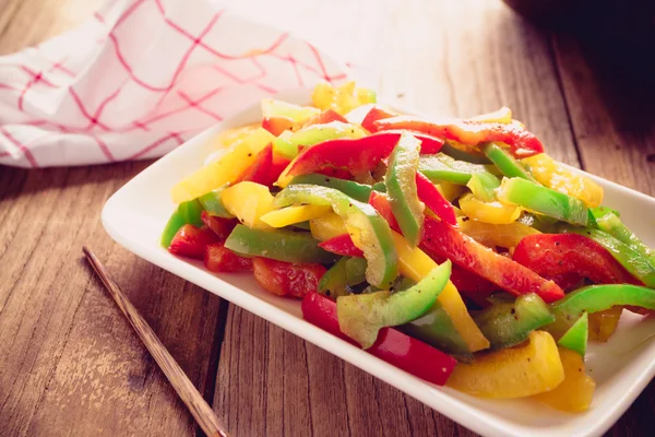 Stir fired mix color of sweet peppers on old wood, Vegetarian fo — Stock Photo, Image