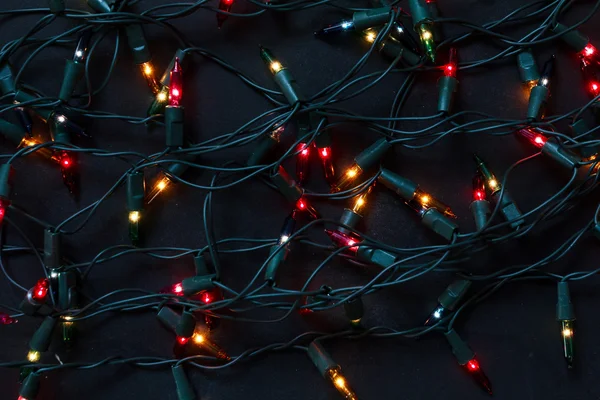 Vánoční světla černé pozadí — Stock fotografie