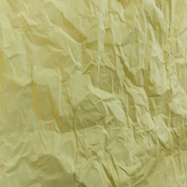 Tom skrynkligt papper i gula tonen — Stockfoto