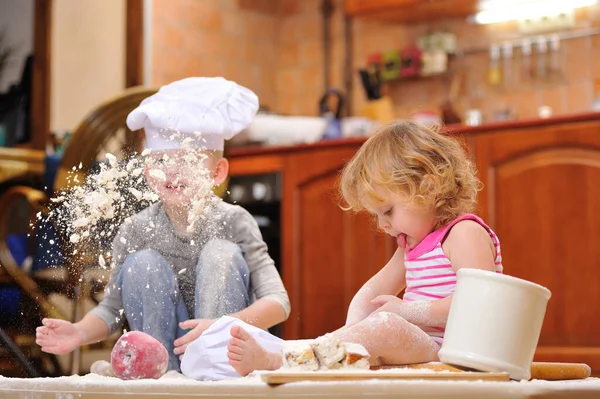 Two Siblings Boy Girl Chef Hats Fireplace Sitting Kitchen Floor — Stock Photo, Image