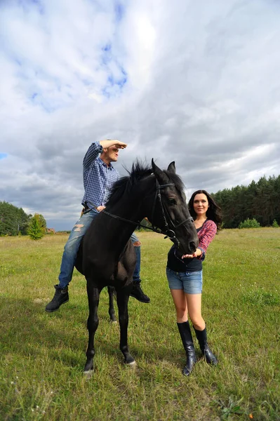 Awaiting Child Walking Meadow Young Couple Plaid Flannel Shirts She — Stock Photo, Image