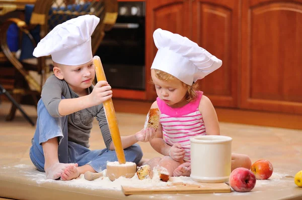 Two Siblings Boy Girl Chef Hats Fireplace Sitting Kitchen Floor — Stock Photo, Image