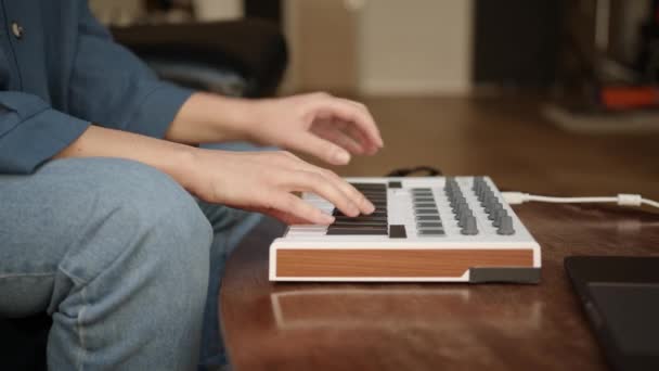 Woman fingers playing chords and melody on keyboard, music production — Stock Video