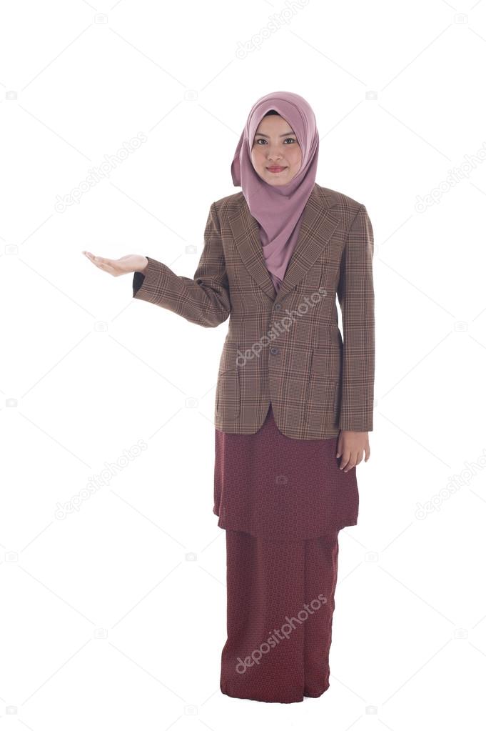 Portrait of beautiful young moslem woman presenting on white bac