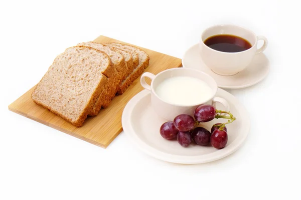 Whole grain bread, grapes and milk serve with a cup of coffee — Stock Photo, Image