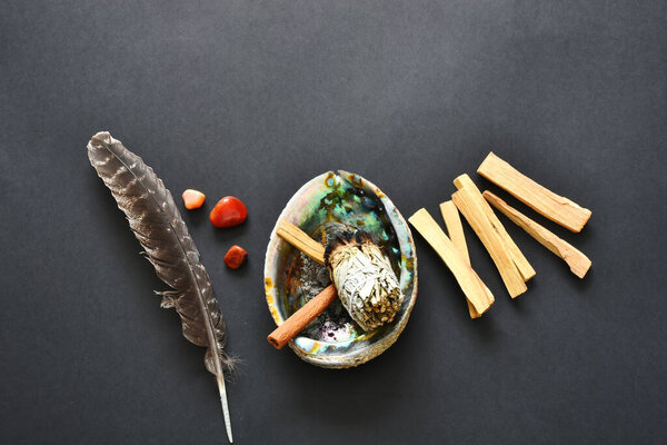 A top view image of a spiritual healing smudge kit bundle on a black background.