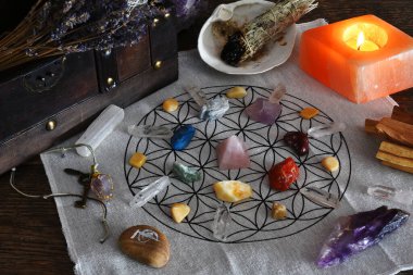 A close up image of a healing chakra grid on a sacred geometry grid cloth.