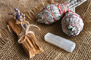 A top view image of Palo Santo with dried lavender on a burlap background.  clipart
