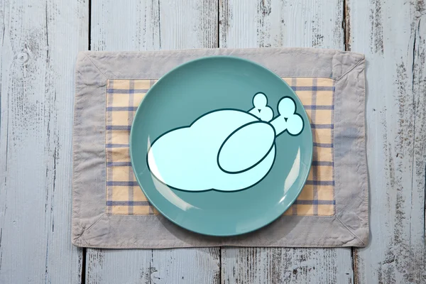 Empty plate with chicken meat sign on light blue wooden background — Stock Photo, Image