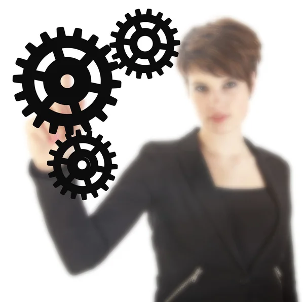 Young businesswoman with black gears isolated on white background — Stock Photo, Image