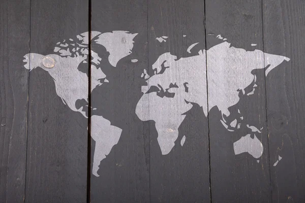 Mapa světa na tmavém pozadí černé dřevěné — Stock fotografie