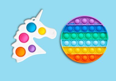 Multi-colored popular silicone anti-stress toy pop it. Colorful anti stress sensory toy fidget push pop it. clipart