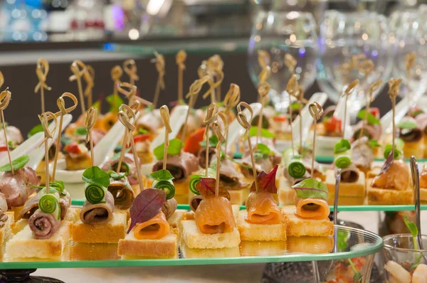 tasty canapes on the buffet in the restaurant. Concept: holidays