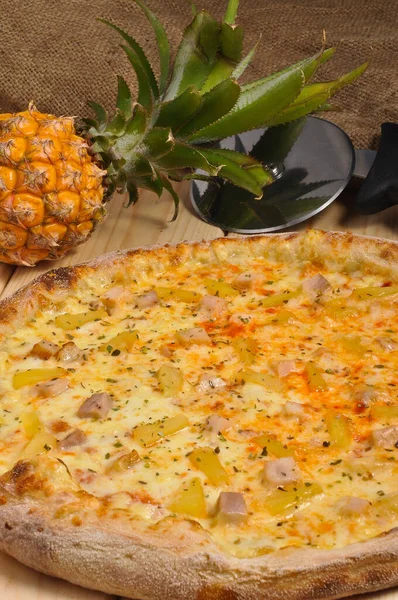 Hawaiian pizza with chicken and pineapple