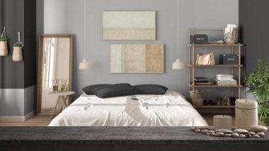 Ahşap masa üstü veya rafta mumlar ve çakıl taşları, zen ruh hali, kırsal kesimdeki yatak odası, çift yatak, yorgan ve yastıklar, ayna ve lamba, iç mimari tasarım