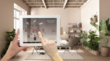 Dijital tablette akıllı uzaktan kumanda sistemi. Uygulama simgeleri olan aygıt. Çift haneli palet yataklı, halı ve koltuklu kırsal yatak odası, mimari iç tasarım.