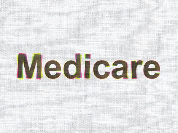 Healthcare concept: Medicare on fabric texture background — Stockfoto