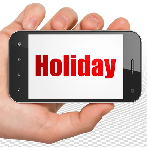 Tourism concept: Hand Holding Smartphone with Holiday on display — Stockfoto