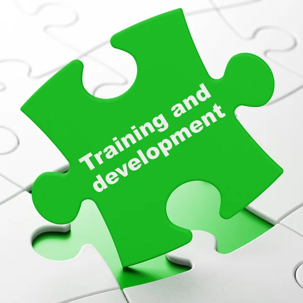 Education concept: Training and Development on puzzle background — Stock Photo, Image