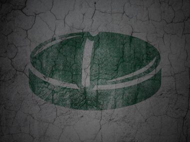 Healthcare concept: Pill on grunge wall background