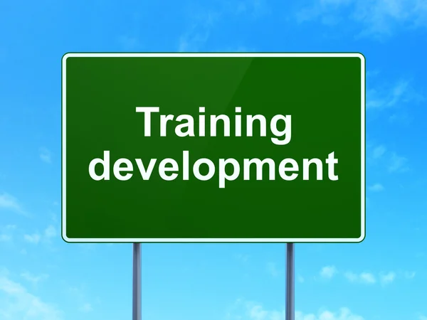 Education concept: Training Development on road sign background — Stockfoto