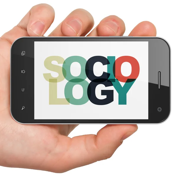 Studying concept: Hand Holding Smartphone with Sociology on  display — Stock fotografie