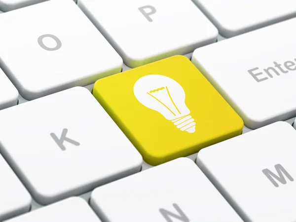 Finance concept: Light Bulb on computer keyboard background — Stock Photo, Image