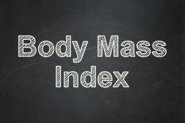 Понятие здоровья: Индекс массы тела на фоне доски — стоковое фото
