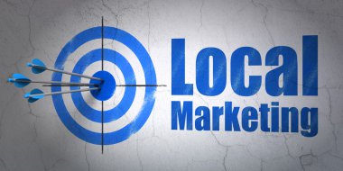 Advertising concept: target and Local Marketing on wall background
