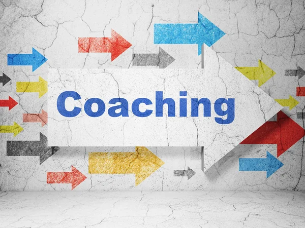 Studying concept: arrow with Coaching on grunge wall background — Stok fotoğraf