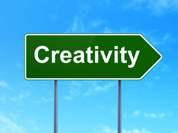 Advertising concept: Creativity on road sign background — Stockfoto