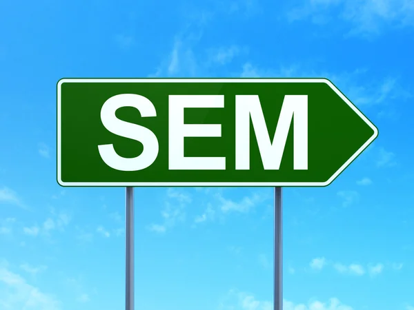 Marketing concept: SEM on road sign background — 图库照片