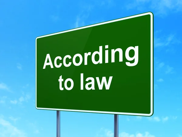 Law concept: According To Law on road sign background — Φωτογραφία Αρχείου