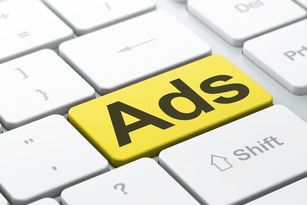 Marketing concept: Ads on computer keyboard background