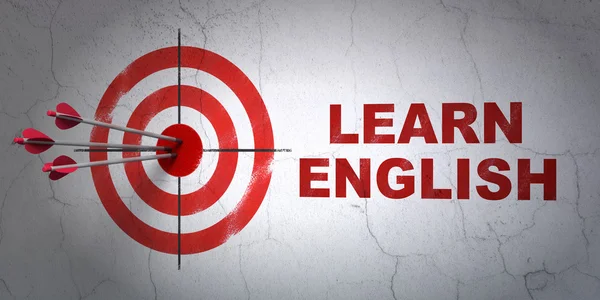 Concept d'apprentissage : cible et apprendre l'anglais sur fond de mur — Photo
