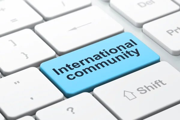 Концепція політики: Міжнародне співтовариство на фоні клавіатури комп'ютера — стокове фото