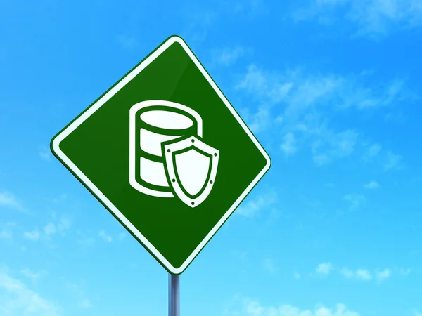 Programming concept: Database With Shield on road sign background — Stock Photo, Image