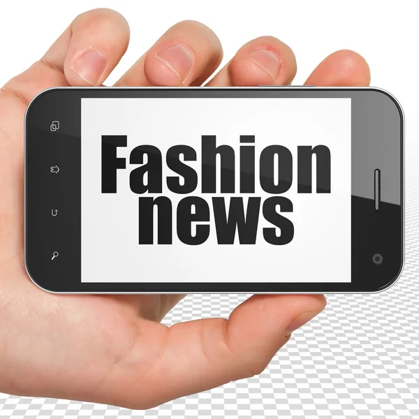 News concept: Hand Holding Smartphone with Fashion News on display — Stockfoto