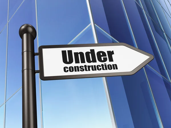 Web development concept: sign Under Construction on Building background — Stock Photo, Image