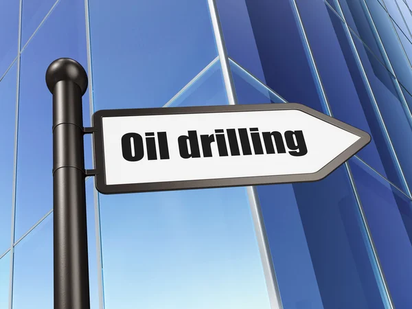 Manufacuring koncept: Sign oljeborrning på att bygga bakgrund — Stockfoto