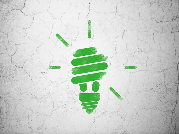 Концепция финансирования: энергосберегающая лампа на стене — стоковое фото