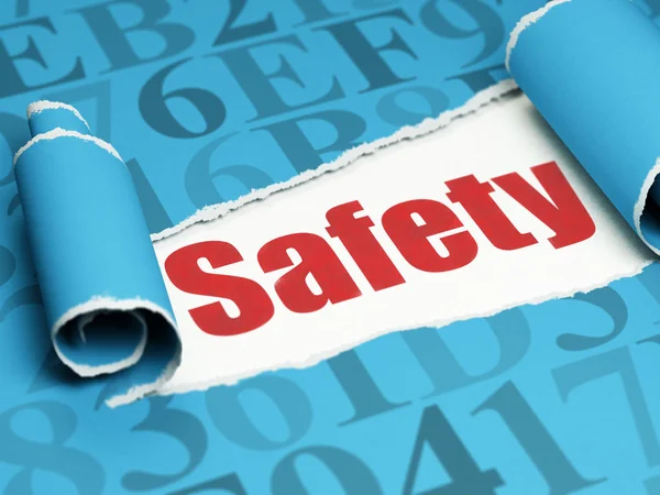 Safety concept: red text Safety under the piece of  torn paper — Stock Photo, Image