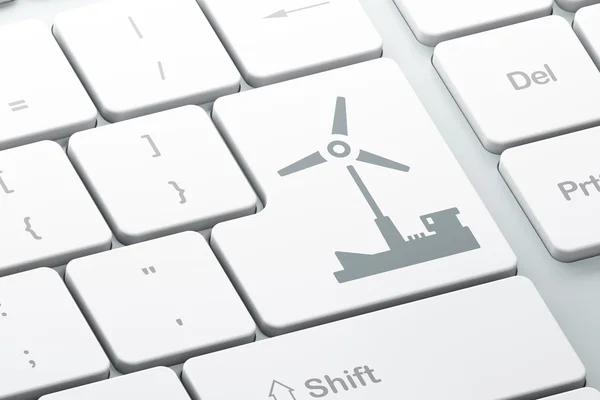 Manufacuring kavramı: bilgisayar klavye arka plan üzerinde yel değirmeni — Stok fotoğraf