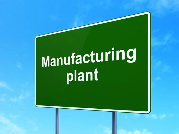 Industry concept: Manufacturing Plant on road sign background — Stock Photo, Image
