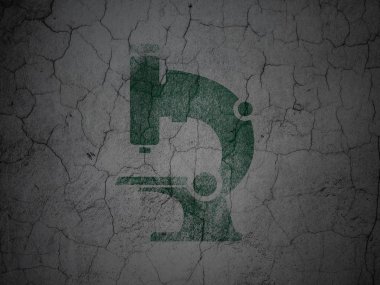 Science concept: Microscope on grunge wall background