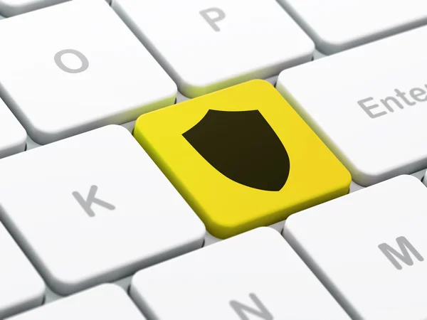 Concetto di protezione: scudo sullo sfondo della tastiera del computer — Foto Stock