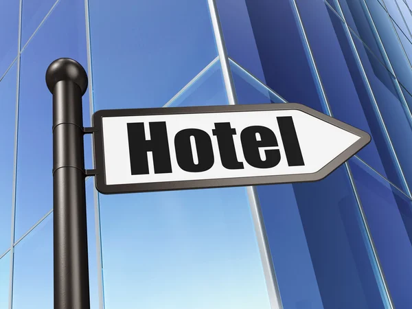 Концепція відпустки: знак Готель на фоні будівлі — стокове фото