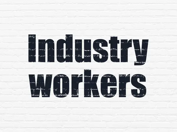 Концепція галузі: промислові працівники на фоні стіни — стокове фото